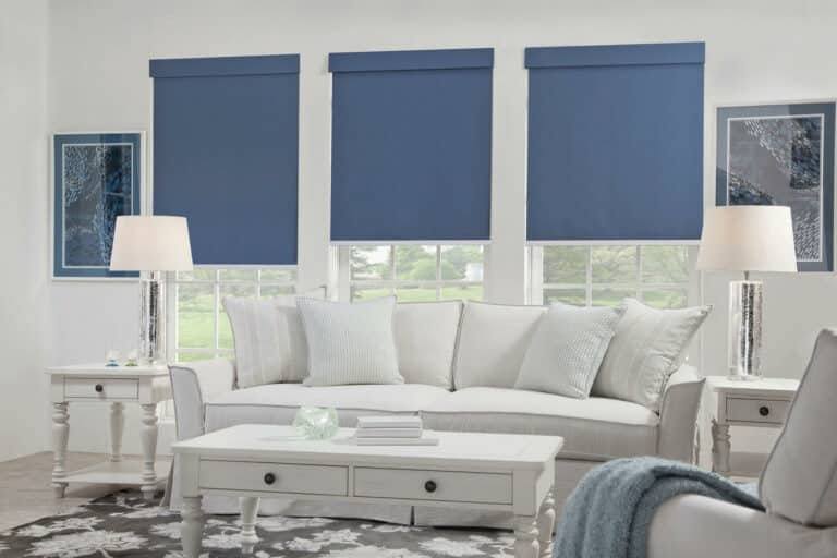 blue roller shades on 3 windows